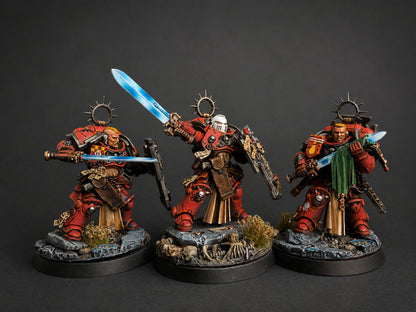 Hand-painted Blood Angels Sanguinary Guard miniatures with red and gold armor and blue power swords, display-level commission by Alto Studio