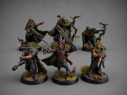 Hand-painted Gaunt's Ghosts Tanith squad miniatures in weathered camo greatcoats on a themed forest base, narrative commission by Alto Studio