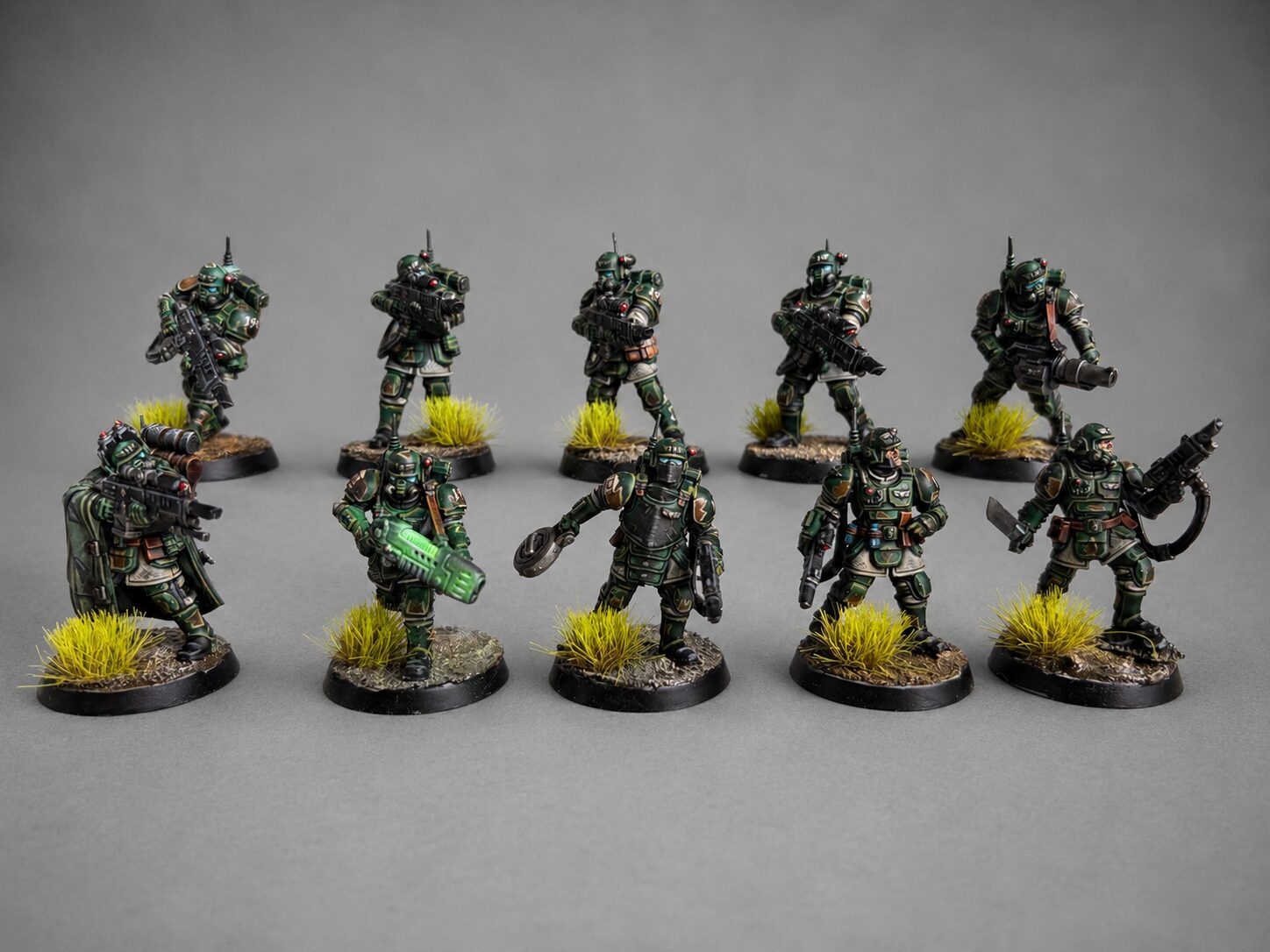 Hand-painted Kill Team Recon Squad of 5 miniatures in dark green camouflage armor, game-level tabletop commission by Alto Studio