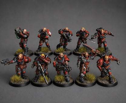 Hand-painted squad of 5 Space Marine scout miniatures in red and black armor with grass tuft basing, game-level tabletop commission by Alto Studio